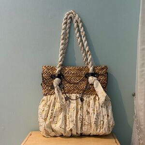 Elegant Beige and Brown Woven Shoulder Bag with gold design.